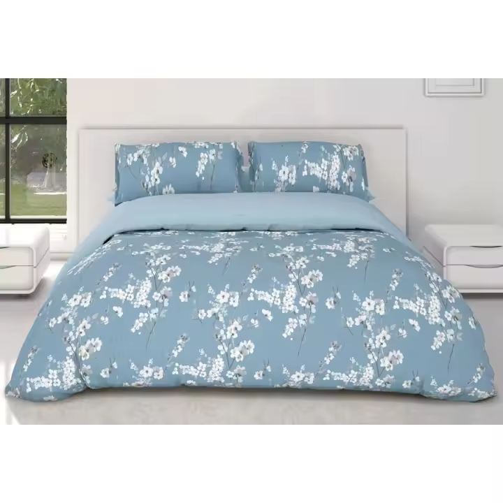 Funda Nórdica Reversible dos en uno con 2 fundas de almohadas tejido de  50% algodón 50% poliéster  Marca Catherine Lansfield, Cama 150 cm, Estampado Flores Azul - 1