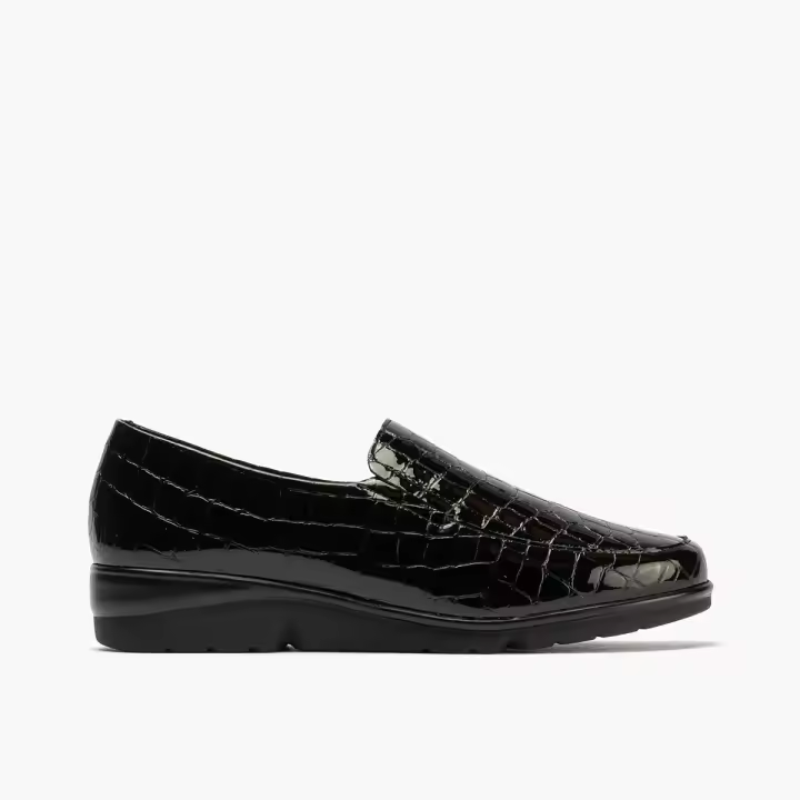 PITILLOS 10003 Zapato mujer tipo mocasín fabricado en piel acabado coco de color negro. Elásticos en los laterales para facilitar su calce y plantillas extraíbles. Suela muy ligera con cuña. - 1