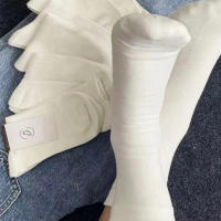 7 Pares De Calcetines De Cuello Redondo Para Mujer En Colores Sólidos Negro Y Blanco Absorbentes De Sudor Transpirables Calcetines Casuales Suaves Y Versátiles - details 0