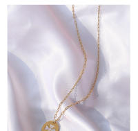Encanto Collar con colgante de flor de cuatro hojas estilo INS europeo y americano, diseño ovalado de concha blanca, cadena de clavícula chapada en oro de 18 quilates y acero de titanio. - details 5
