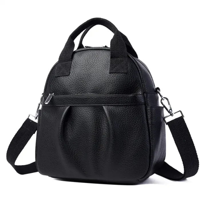 Mochila versátil para mujer, nueva mochila de estudiante de cuero suave de PU, impermeable, de color sólido, sencilla, de gran capacidad. - 1