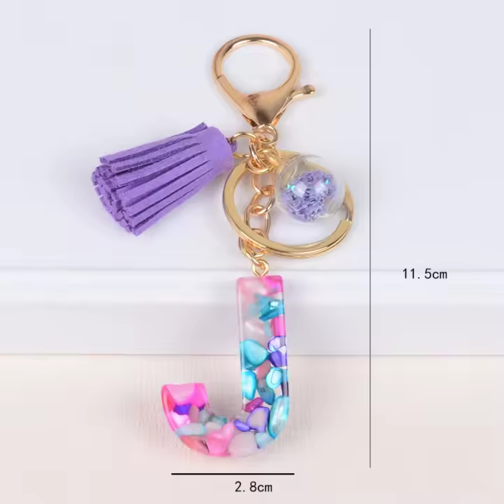 Llavero Con Inicial Colorido Y Borla Morada Para Mujeres Y Niñas Colgante Para Bolso Y Billetera Material De Resina Estilo Clásico - 1
