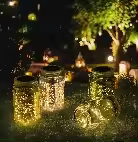 Lámpara solar para jardín Outsunny - 4 frascos Mason - Farol de vidrio solar LED resistente al agua IP44 - Luces decorativas para jardín de 4 colores - 1