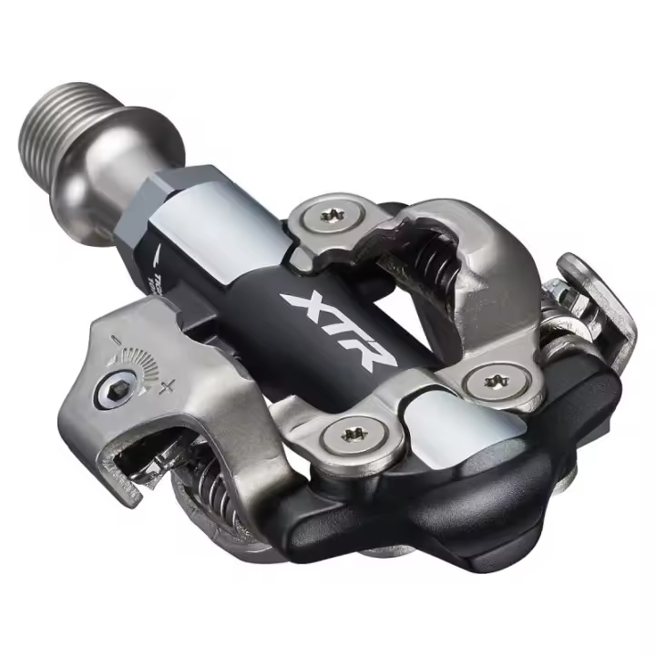 SHIMANO | Pedales De Mtb XTR M9100 -3mm - Área de contacto pedal-zapatilla mejorada con perfil antibarro 
Mayor anchura de los rodamientos para una buena rigidez y una distribución uniforme de la - 1