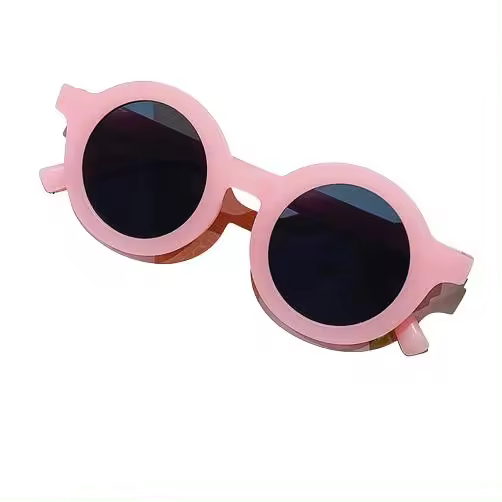 Sunny Kids Gafas de Sol Proteccion UV400 +  Funda para Niños y Niñas Gafas de sol Redondas Color Rosa Cherry Regalos para El Verano Gafas de Moda Infantil 2-6 Años - 1