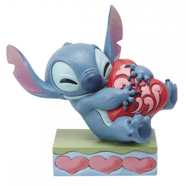 Figura enesco disney stitch abrazando un corazón - 1