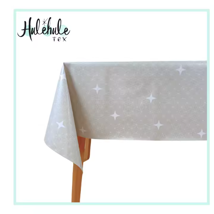 Mantel Hulehule Tex - Hule PVC Estampado Estrellas Blancas Fondo Beige Resistente a Manchas Impermeable 140cm Ancho - 1