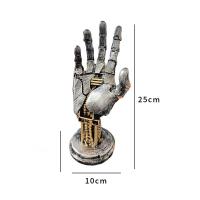 Figura de mano mecánica en resina , soporte para mandos de juego - details 0