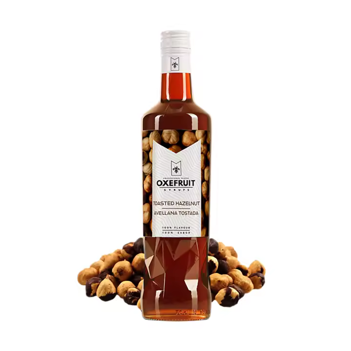 SIROPE DE AVELLANA TOSTADA Oxefruit Professional Mixers. Producido a partir de concentrado de avellana tostada, con auténtico sabor, creado para la elaboración de cócteles y bebidas no alcohólicas como mocktails, batidos y también para repostería. - 1