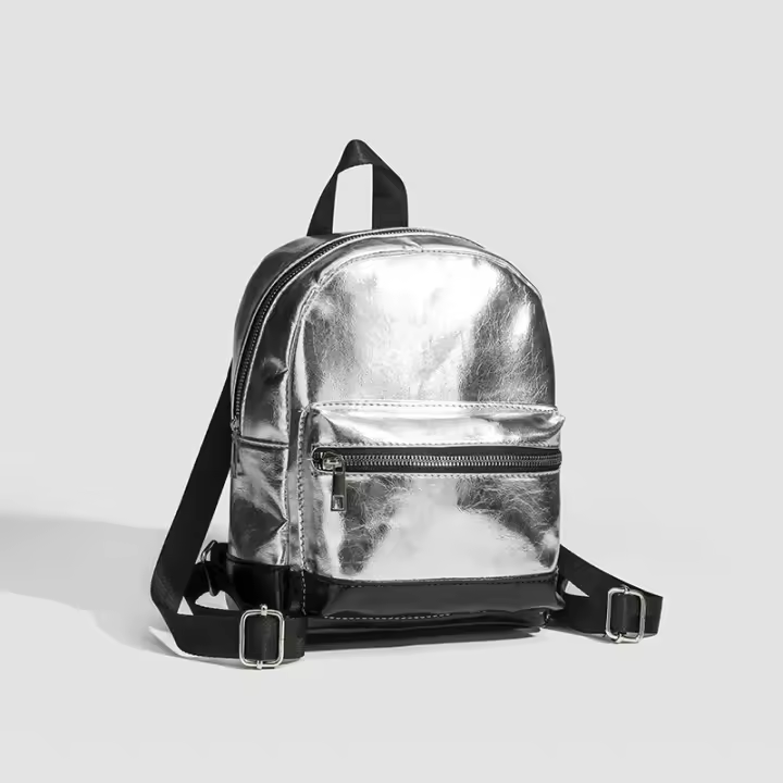 Mochila pequeña de textura plateada para mujer, nueva mochila de estudiante coreana de verano 2024, mochila portátil de estilo moderno y popular. - 1