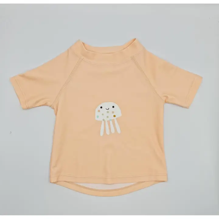 Camiseta niña con proteccion solar +50 ,marca Monuagge.Nuestros bañadores pañal tienen además un forro resistente al agua que mantiene la piel seca.Testado con norma europea EN 13758-1.El tiempo de protección efectiva de la prenda contra rayos es en seco. - 1