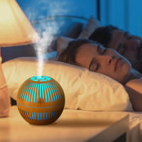 Nueva y creativa máquina de aromaterapia de aceite esencial de grano de madera hueco de estilo retro redondo creativo mini humidificador USB para el hogar, grano de madera claro - details 0
