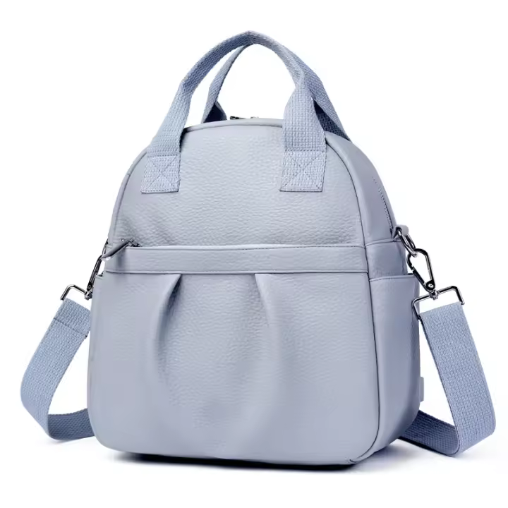 Mochila versátil para mujer, nueva mochila de estudiante de cuero suave de PU, impermeable, de color sólido, sencilla, de gran capacidad. - 1
