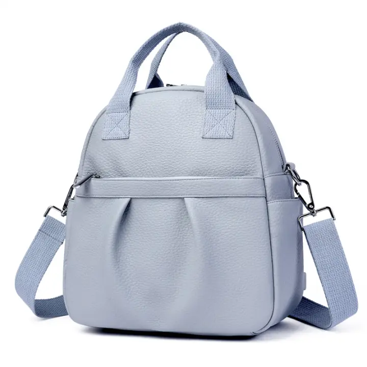 Mochila versátil para mujer, nueva mochila de estudiante de cuero suave de PU, impermeable, de color sólido, sencilla, de gran capacidad. - 1