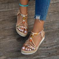 Perfect for the beach, these casual, bohemian-inspired women's wedge sandals feature hand-woven multicolor elastic and an open toe. - details 0