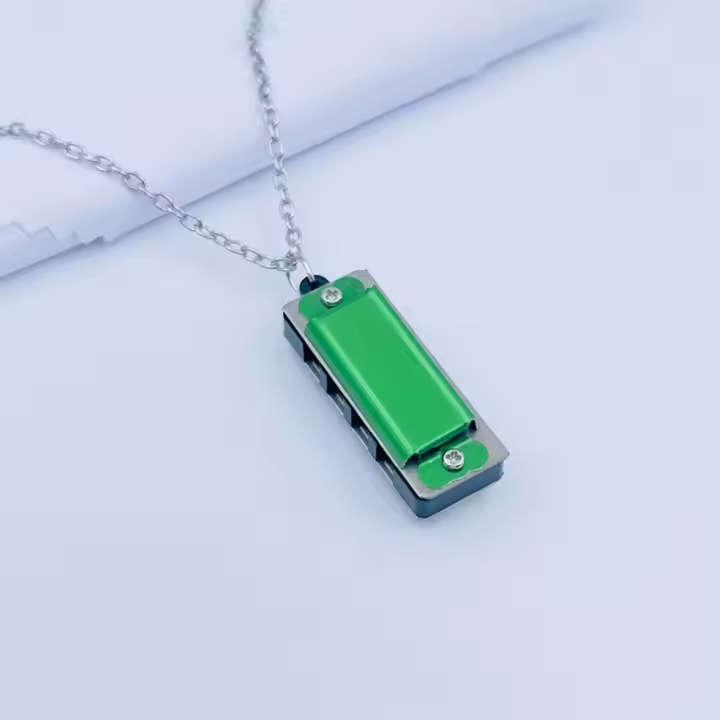 Nueva Armónica De 8 Tonos Con 4 Agujeros Mini Armónica De Metal Instrumento De Viento Cadena Juguete Musical Regalo - 1