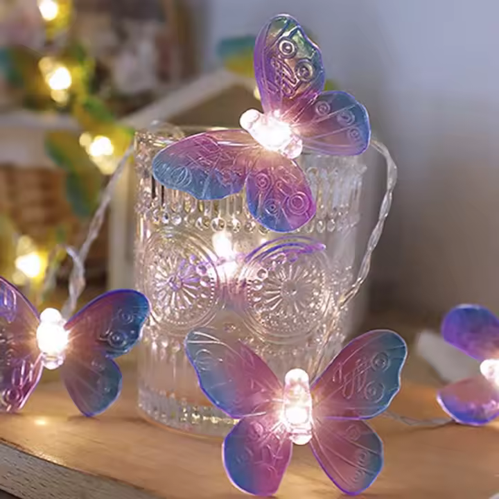 Cadena de luces LED con forma de mariposa de 20 LED, 3 metros de largo, funciona con pilas, color morado, para decoración de fiestas en el jardín del hogar - 1