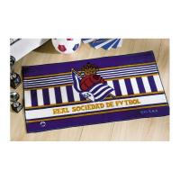 Alfombra Tapete Real Sociedad de Futbol.  Ideal para colocar a los pies de la cama.  Medidas: 55x110 cm.  Composición: 85% acrílico 15% poliéster  Los colores pueden diferir ligeramente de la imagen mostrada  Fabricado en España  Licencia Oficial - details 0