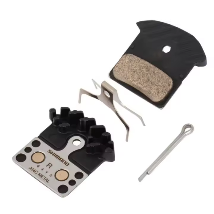 SHIMANO | Pastillas De Freno Sinterizadas J04C - Compuesto: metal sinterizado.
Vida útil más larga.
Buena consistencia en seco y en mojado
Aleta refrigerador de radiador de aluminio que reduce la - 1