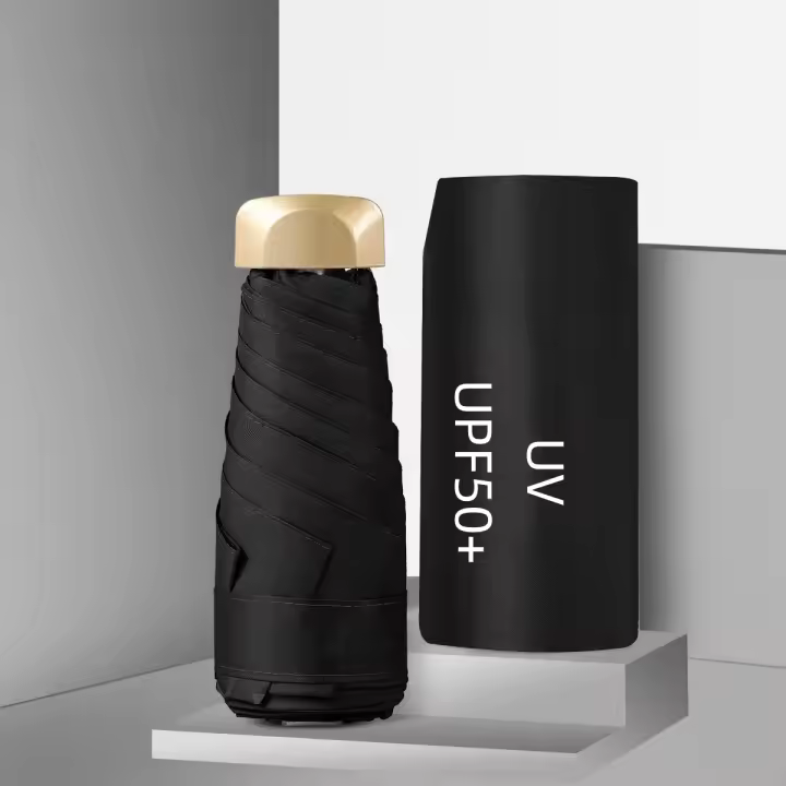 Mini Paraguas UV plegable de viaje portátil Protección solar Y Lluvia UPF50 + Vinilo cubierta Negra para adultos Sombrilla Capsule - 1
