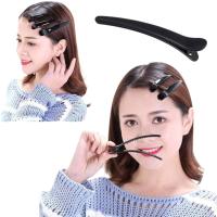 Pack de 12 pinzas negras de plástico dentadas estilo pico de pato. Pinzas de plástico de calidad para peluquerías. - details 0