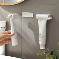 Exprimidor de pasta de dientes de succión magnética, dispensador de pasta de dientes creativo montado en la pared, práctico estante de baño - details 1