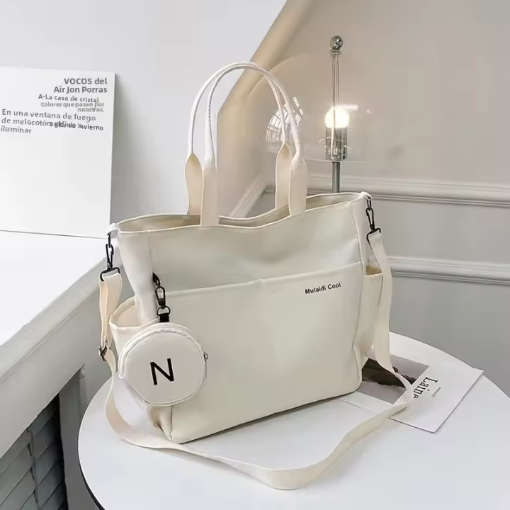 Bolso bandolera de mujer en lona estilo fashion con cierre crema - 1