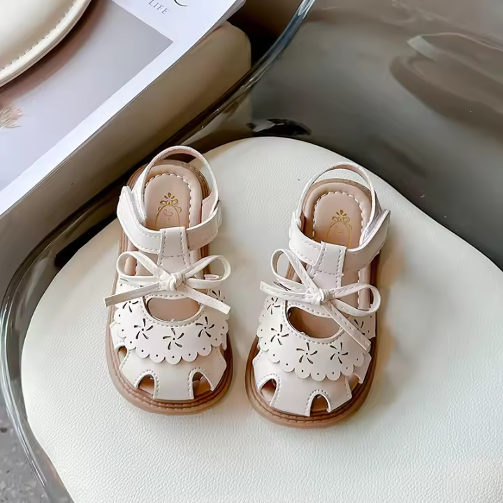 Niñas arco zapatos de bebé 2025 verano nueva bolsa de los niños cabeza sandalias niñas princesa zapatos de suela blanda - 1