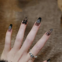 Uñas postizas con patrones negros y estrellas ideales para principiantes en Nail Art - details 1