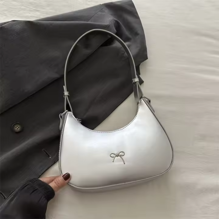 Nuevo diseño de moda, bolso para axila con lazo, bolso de cuero PU coreano con lazo para axila, bolso de lujo Y2K de Color sólido para niñas - 1