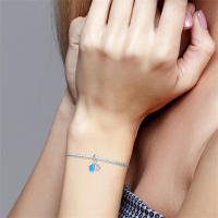Conjunto de dijes para pulsera de dos piezas con ojo mágico brillante, fabricado en plata con piedra principal de circonia. - details 1