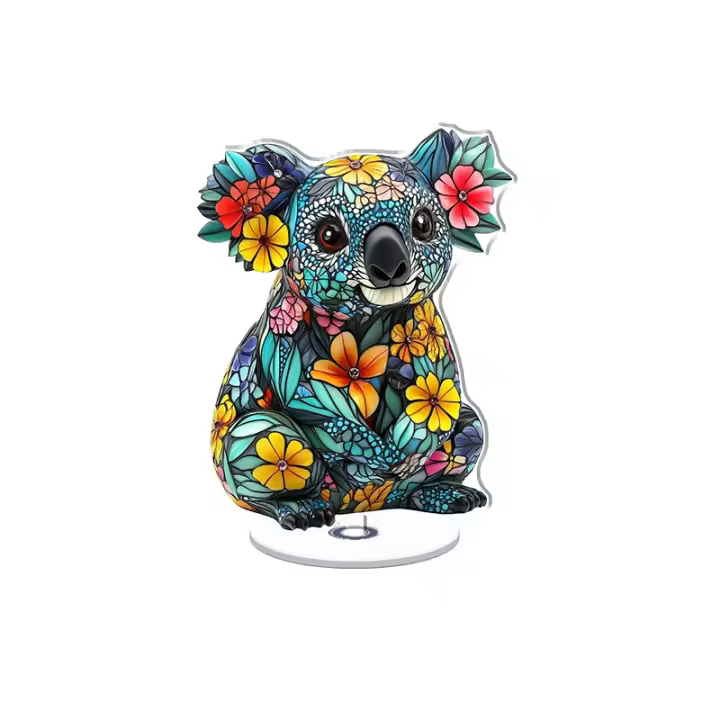 Expositor acrílico giratorio con un vibrante diseño de koala con motivos florales en turquesa y colores brillantes sobre un fondo blanco. - 1