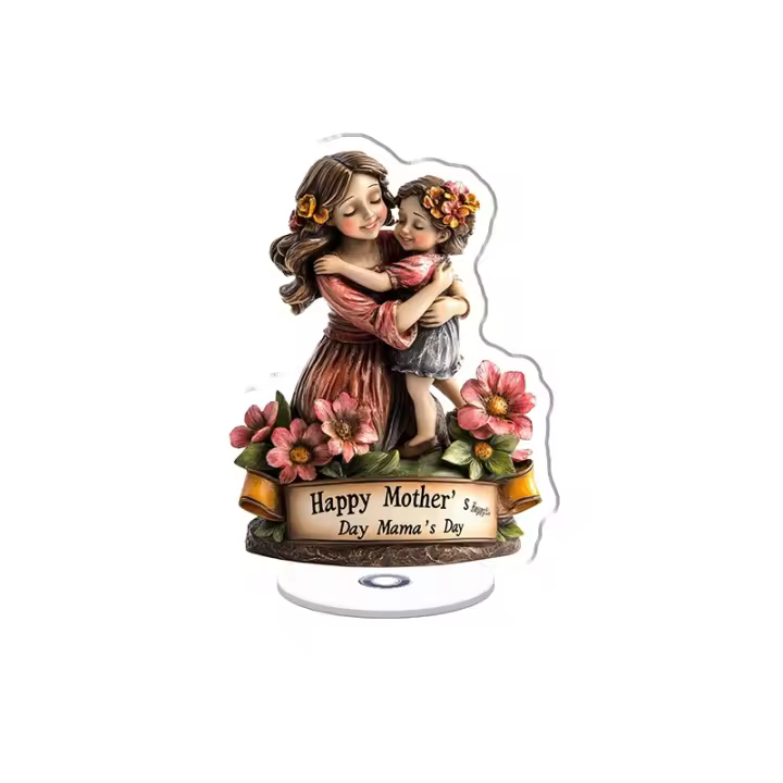 Expositor acrílico giratorio con una escultura de madre e hijo con flores y un cartel de Feliz Día de la Madre sobre una base que lleva el texto Mama's HUG - 1