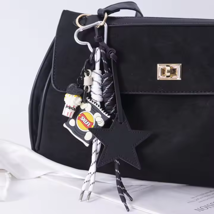 LLavero de palomitas de maíz y patatas fritas en forma de estrella, colgante de bolsa de cuerda trenzada hecha a mano de PU, llavero de estrella de cuero tejido a mano de estilo coreano - 1