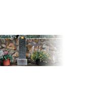 Curved water founain is shown in a backyard patio area