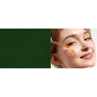 Young adult woman applying vitamin c serum