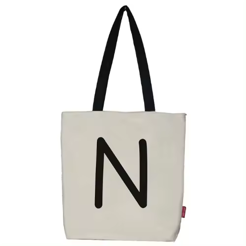 Bolso tote con cremallera, forro y bolsillo interior. Exterior: Algodón 100%. Incluye sobre de regalo de papel kraft. Modelo N. Color: Crudo / Negro. Medidas: 37x38 cm. - 1