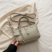 Bolso de mano elegante con forma de cubo cruzado inclinado, bolso de mano con colgante de cachorro para mujer, bolso de hombro de cuero de PU de alta gama con patrón de lichi, primavera y verano - details 24