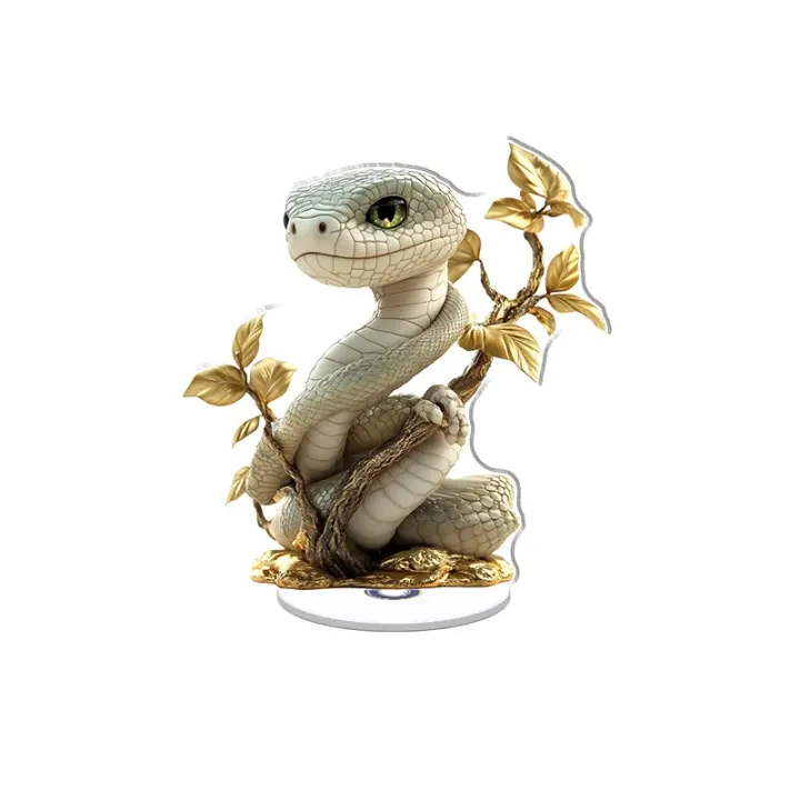 El adorno acrílico giratorio presenta una serpiente blanca en una rama dorada con ojos luminosos y hojas doradas, que evocan una esencia mística y encantadora. - 1