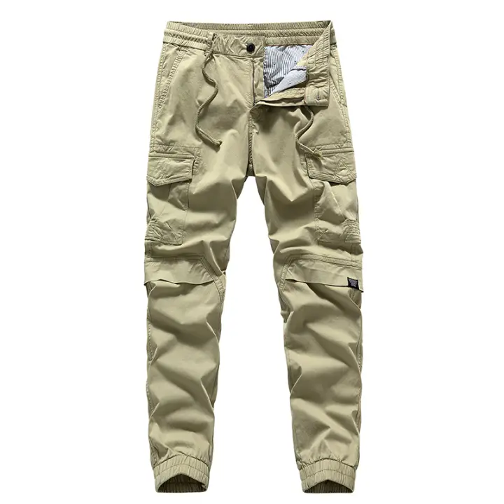 Pantalón de hombre de color liso, corte holgado, múltiples bolsillos, banda elástica. - 1