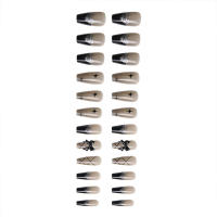 Uñas postizas con patrones negros y estrellas ideales para principiantes en Nail Art - details 0