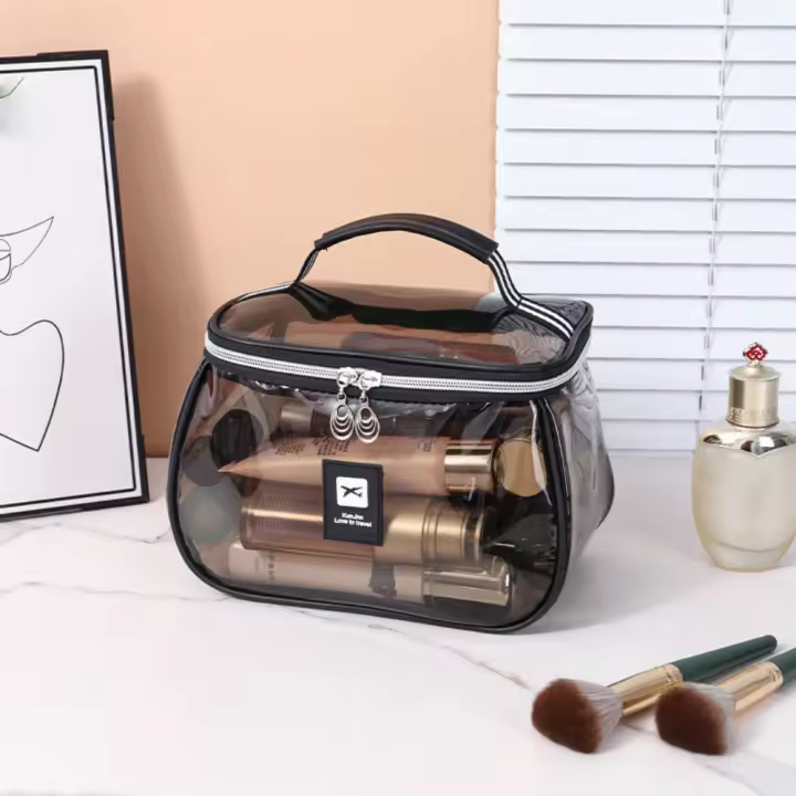 Bolsa de cosméticos de PVC transparente portátil, bolsa de maquillaje transparente impermeable de mano, organizador de almacenamiento de artículos de tocador de gran capacidad de PVC para mujer - 1