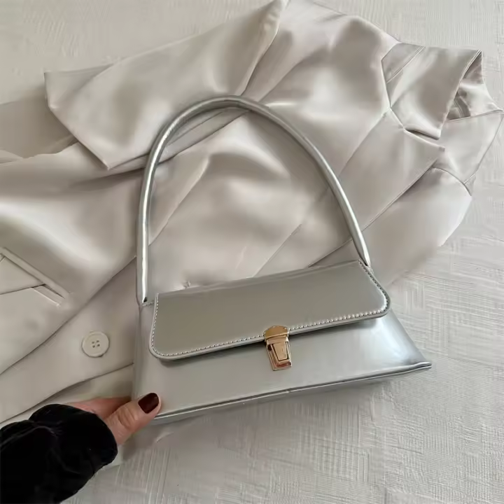 Temperamento simple, bolso de hombro con cierre de color sólido, artículo nuevo primavera/verano 2024 para mujer, textura de nicho de alta gama, bolso para las axilas, bolso para mujer - 1