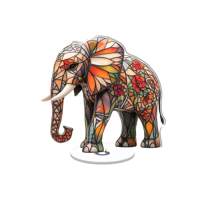 Escultura acrílica giratoria que muestra un elefante vibrante estilo vidriera adornado con patrones geométricos y suculentas del desierto sobre un fondo blanco brillante. - 1