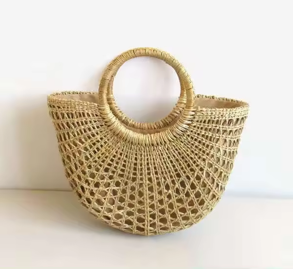 Producto al por mayor, bolso de mano de playa con hombro de señora de verano medio redondo de Color sólido Simple ahuecado, bolso de mano de paja tejido - 1