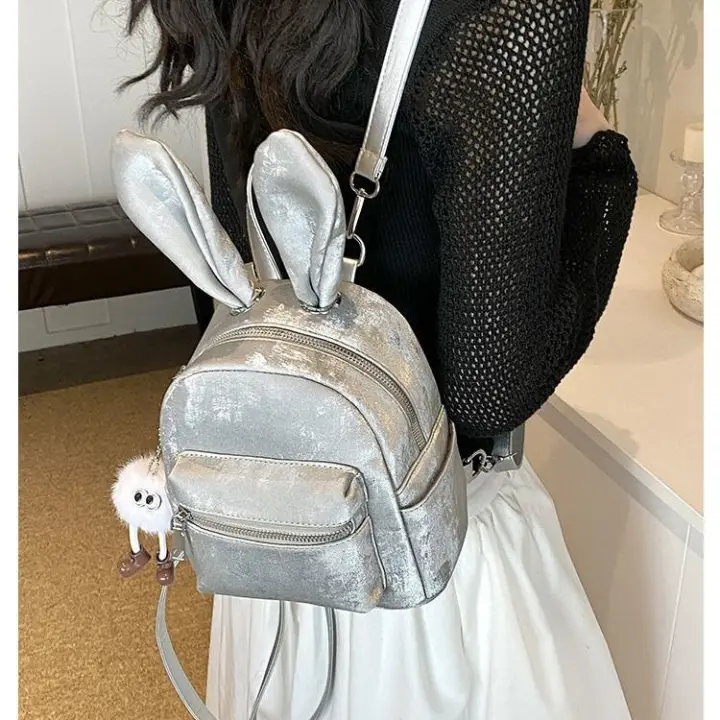 Mochila bonita y versátil de estilo coreano, mochila de viaje para estudiantes, minimochila informal con orejas de conejo desmontables - 1