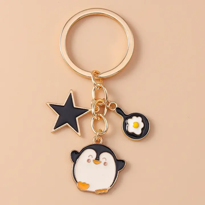 Llavero de Esmalte de Dibujos Animados Perro Pingüino Corazón Estrella Ideal para Mujeres Hombres - 1