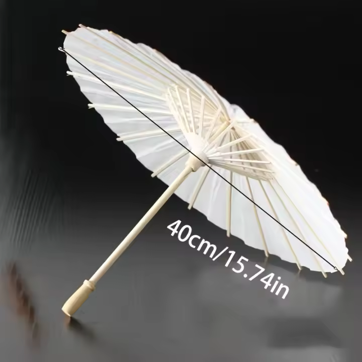 Un paraguas de papel blanco para decoración de bodas - sombrilla nupcial tradicional china hecha a mano - accesorio fotográfico y accesorio de fiesta - 1