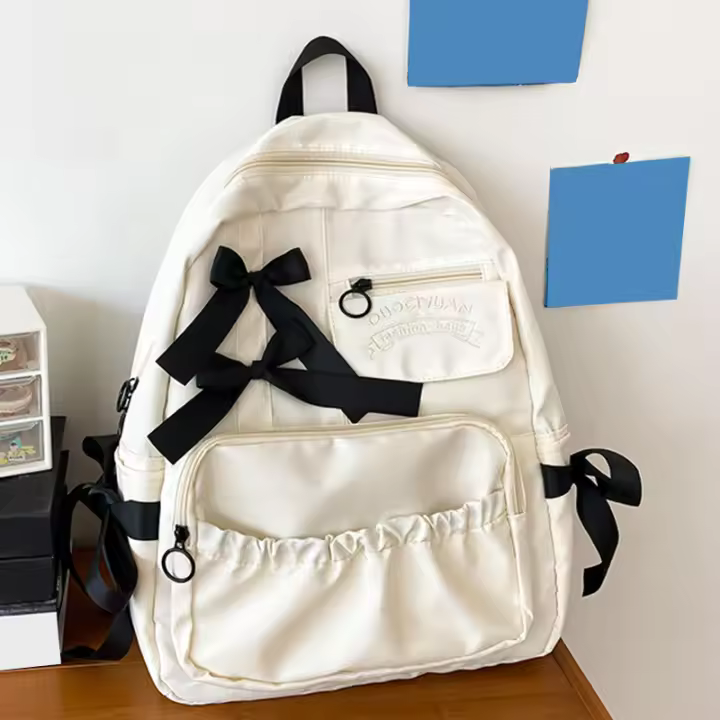 Mochila escolar con lazo para mujer y niña, morral bonito con personalidad, estilo universitario - 1