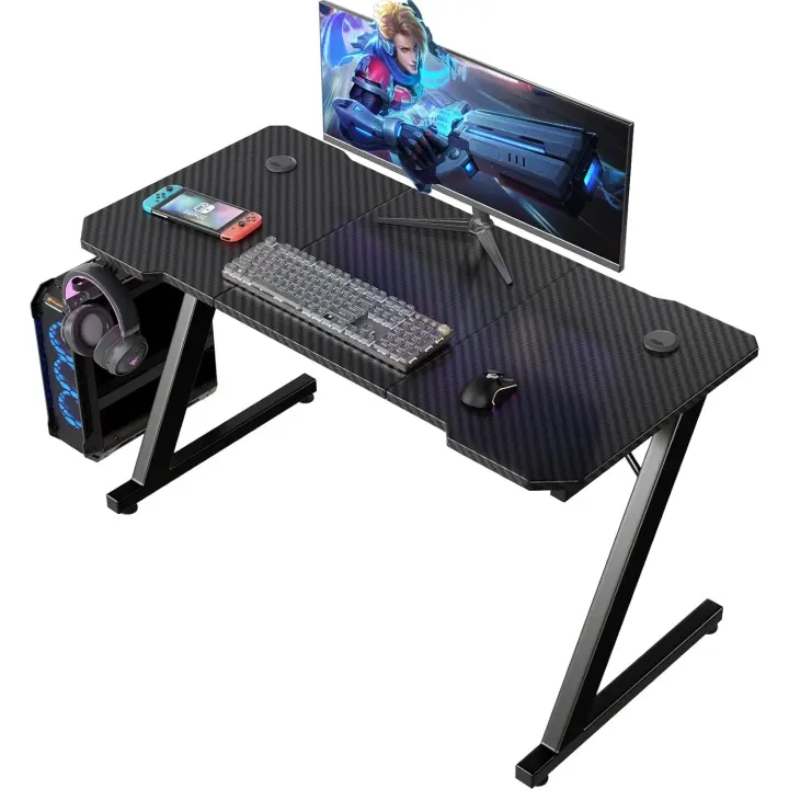 Mesa Gaming 120 x 60 cm, Escritorio Gaming en Forma de Z Ergonómica, Mesa Gamer de Fibra de Carbono, Mesa para Ordenador con Gancho para Auriculares, Negro - 1